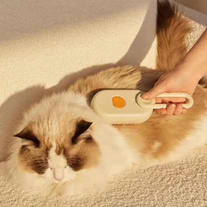 MUO Studios rechargeable pet spray brush being used to groom a fluffy white and brown cat on a beige carpet